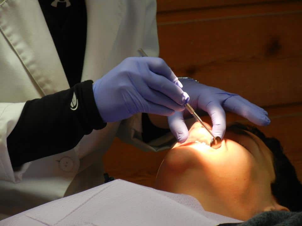 Dentist checking patient